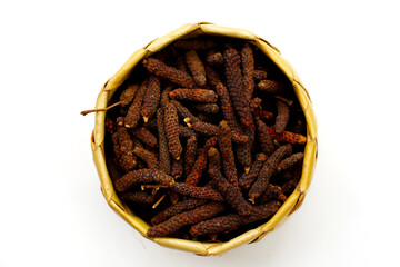 Long pepper (Piper longum), a spice used in traditional medicine and cooking, known for its pungent flavor.