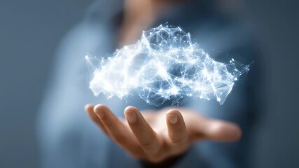 A person holds a glowing digital cloud above their hand, symbolizing modern cloud computing and data technology. Futuristic network connections illustrate innovation and connectivity - Powered by Adobe