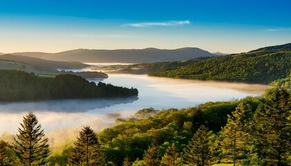 Obraz premium Overlooking A Misty Lake And Forested Hills