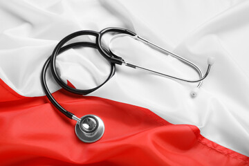 Stethoscope on flag of Poland, top view