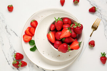 Bowl with fresh ripe strawberries on white background