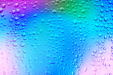 Glass surface with water drops, closeup view