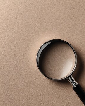 Magnifying Glass on Textured Beige Background with Soft Lighting and Sharp Focus