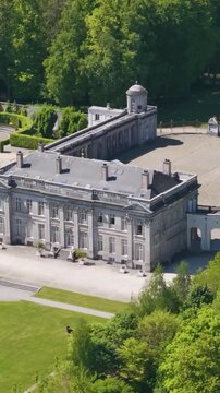 main area structures ch&acirc;teau seneffe gate surrounding green covers visitors walking outside add vibrancy to revealing left right front pans aerial of 
