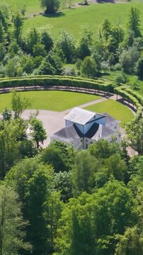 ch&acirc;teau seneffe along surrounding green areas dry ponds well maintained parks fields enhance estate's to revealing left right backside pans aerial of 