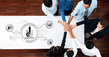 Diverse team members collaborate to enhance productivity in a modern office environment, showcasing teamwork and strategic planning through innovative interactions. Trope