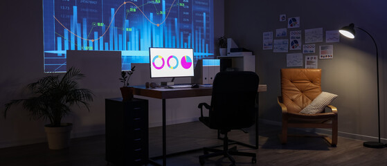 Interior of dark data scientist's office with workplace and projection on wall