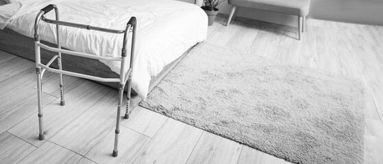 Medical walker on floor in bedroom