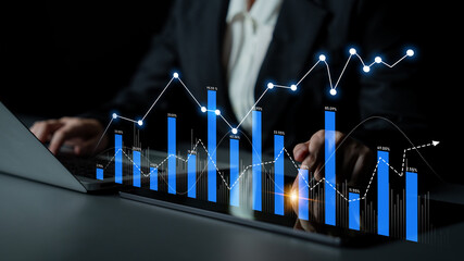 A business professional engages in data analysis using a laptop, illustrating financial trends with vibrant charts and graphs against a dark backdrop. Scalp