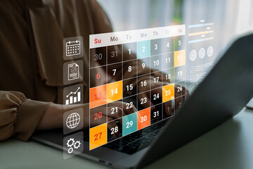 Close-up of a digital calendar shown on a laptop screen. The interface displays scheduling features, charts, and graphs to improve organization and productivity. Gantry