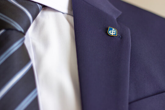 Professional business suit jacket with Pacific Bank lapel pin