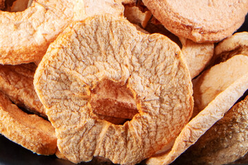 Close-up of Textured Dried Apple Slices and Rings for Healthy Snack