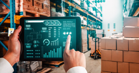 Warehouse management innovative software in computer for real time monitoring of goods package delivery . Computer screen showing smart inventory dashboard for storage and supply chain distribution .