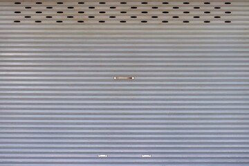 Old and dirty roll up steel door pattern background