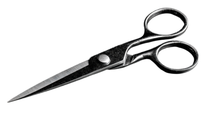 Close up metallic sewing scissors with sharp blades and finger loops on a dark surface for crafts and tailoring applications