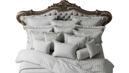 Top view composition of a luxurious hotel style bed with an ornate headboard and many pillows isolated on white background