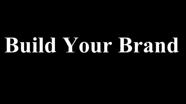 Motivational phrase build your brand displayed in white serif font against a solid black background