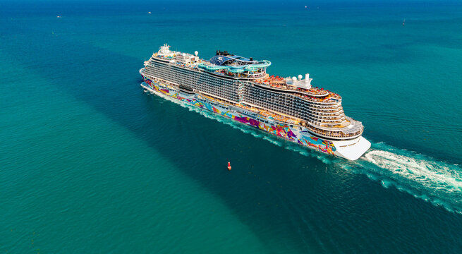 Miami, Florida, USA - April 16, 2025: Norwegian Aqua cruise ship voyage. Cruise in summer vacation. Norwegian cruise line. Cruise ship tour and travel at sea. Ship leaving Miami beach port. NCL