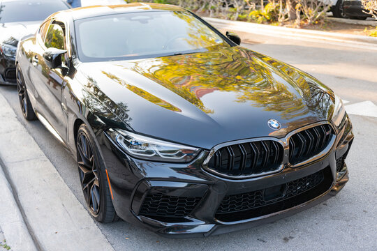 Miami, Florida, USA - April 17, 2025: Luxury car BMW M8 Competition. Car BMW M8 Competition parked outdoor. Black color car, corner view. 2020 BMW M8 Competition car