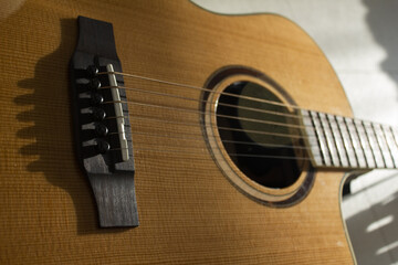 Fototapeta premium This is a close-up of the strings of an acoustic guitar.