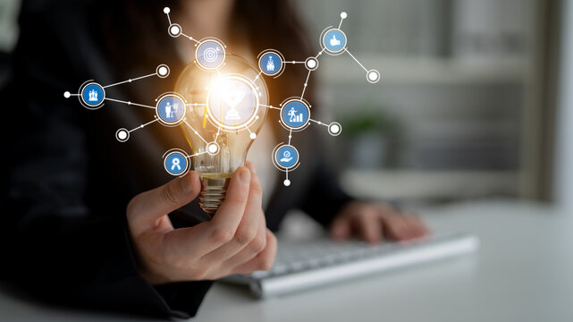 A creative representation of business innovation featuring a light bulb and networking icons, symbolizing the connection between ideas and technology for success. Tessel - Powered by Adobe