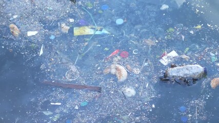 Water pollution shows debris in the river