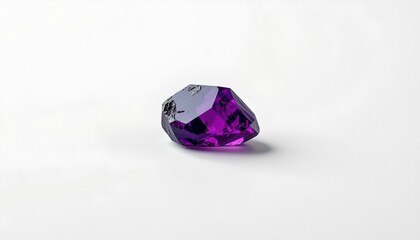 A large, deep purple gemstone, prominently displayed against a contrasting white background.