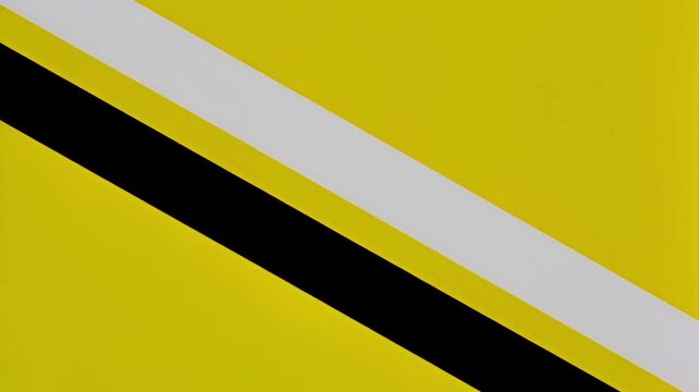 Dynamic Abstract Video of Bright Yellow Background with Bold Diagonal Black and White Lines