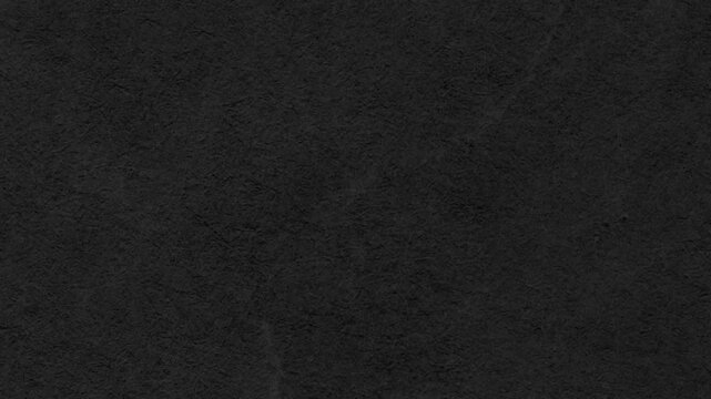Dark Black Textured Slate Stone Surface Background for Professional Minimalist Video Design.High-quality dark charcoal textured background perfect for cinematic overlays, minimalist designs