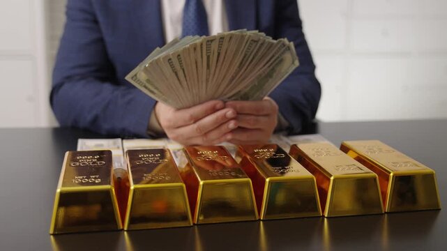 Golden bar vs dollar money. Rich businessman saving gold and cash money. Financial saving success. Successful rich man with gold and money. Business success man with gold bar. Golden bar