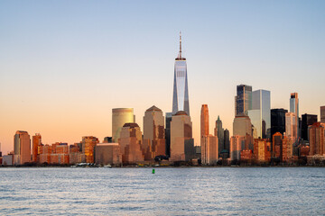 Obraz premium Manhattan skyscrapers with blue tones in New York NYC. Manhattan cityscape photography in New York NYC. Manhattan panorama with urban towers in New York NYC.