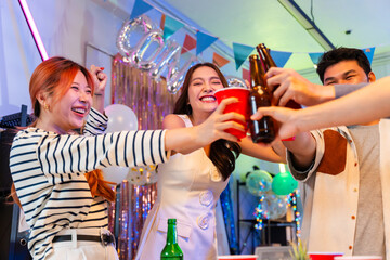 Asian business team celebrating New Year 2026 or major milestone achievement in office party,holding large 2026 foil number balloons and confetti falling.Concept of corporate success,festive teamwork 