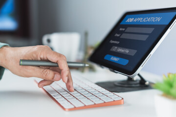 Typing job application form on tablet interface