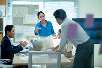 creative Business designer applaud for job success at meeting at office.Planning and brainstorm strategy is the first step.shot of a group of young Asian business people planning on a glass board. 