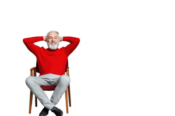 An elderly man with a white beard and a red sweater sits comfortably on a wooden chair with his hands behind his head and smiling against a transparent background