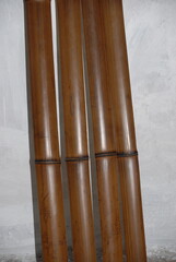 Artisanal process of covering door windows with natural bamboo sticks using basic hand tools and safety gloves