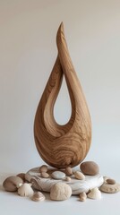 Elegant wooden teardrop sculpture with seashells
