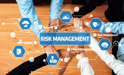 A diverse team collaborates to develop effective risk management strategies, highlighting teamwork,...