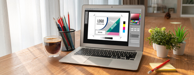 Graphic designer software for modern design of web page and commercial ads showing on the computer screen