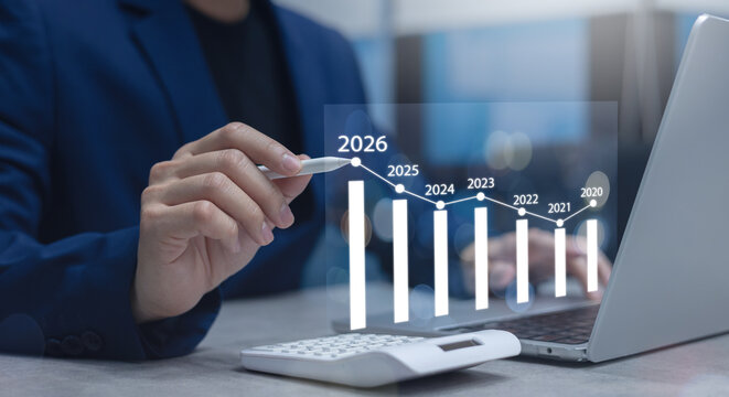 close up manager businessman write and think strategy of business profit with virtual statistic graph for new year 2026 target and financial forecasting in office room concept
