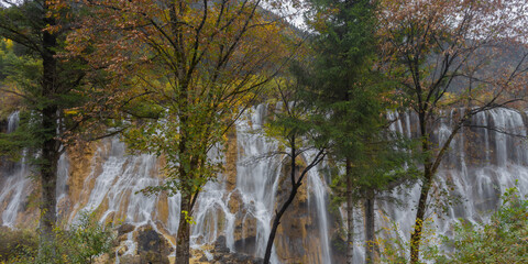 The beautiful Nuorilang Waterfall in Jiuzhaigou National Park, Sichuan Province, stands 24.5 meters...