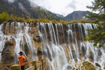 The beautiful Nuorilang Waterfall in Jiuzhaigou National Park, Sichuan Province, stands 24.5 meters...