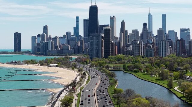 Downtown Chicago Cityscape Skyline, Drone Shot of Central Buildings From Traffic on Lake Shore Drive