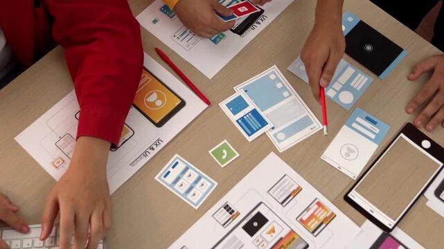 Top view panorama video of startup company employee planning on user interface prototype for mobile application or website in office. UX UI designer brainstorm user friendly interface plan. Synergic