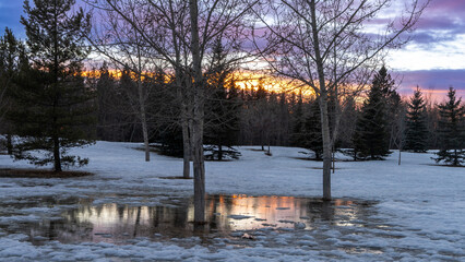 Winter warming snow meltdown landscape at sunset time