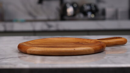 Wooden board for cutting on white marble background