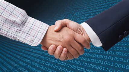 Business partnership handshake over digital data background