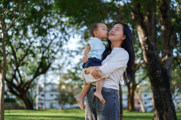 Mother and child sharing loving moment in park