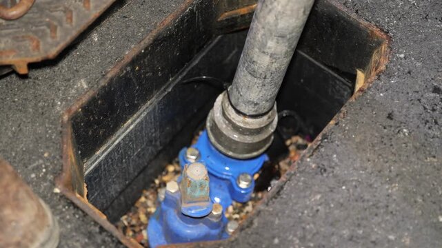 Metal standpipe connects to underground hydrant for controlled water supply