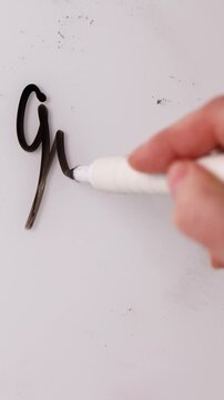 People are marking down prices on a whiteboard. Discounts are being written clearly to show flash sale details. The prices are changing for customer savings. Act fast for the best deals.